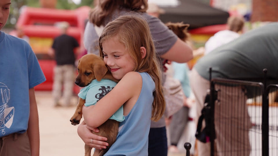 Family with adoptable puppy